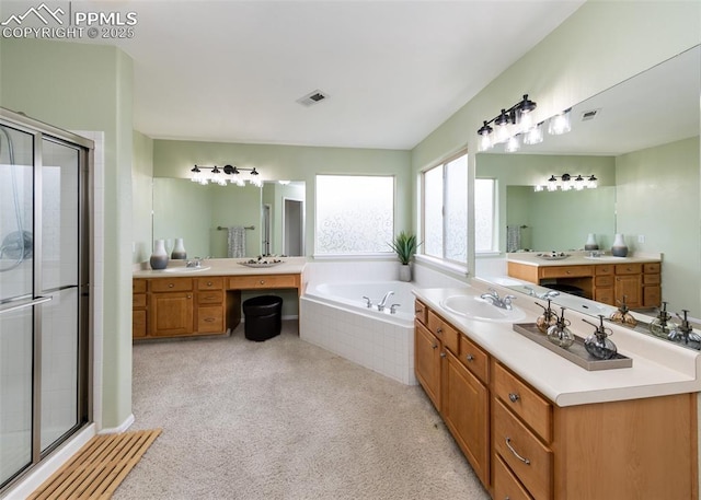 12515 Broad Oaks Dr, Colorado Springs, CO 80921 - full bath featuring a stall shower, vanity, and a garden tub
