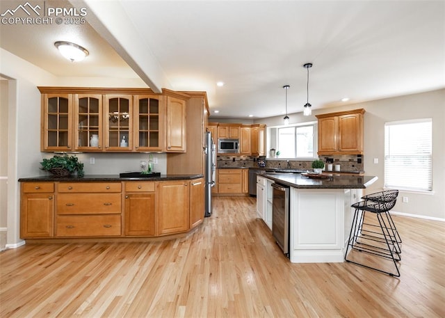 12515 Broad Oaks Dr, Colorado Springs, CO 80921 - kitchen featuring appliances with stainless steel finishes, wine cooler, a breakfast bar area, light wood-style flooring, and recessed lighting
