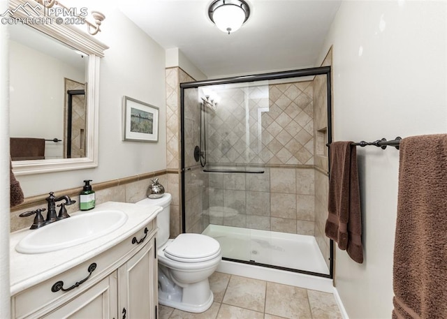 12515 Broad Oaks Dr, Colorado Springs, CO 80921 - bathroom featuring vanity, a shower stall, toilet, and tile patterned flooring