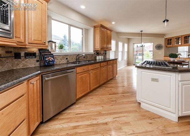 12515 Broad Oaks Dr, Colorado Springs, CO 80921 - kitchen with stainless steel appliances, a sink, light wood-type flooring, healthy amount of natural light, and recessed lighting