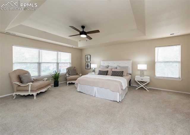 12515 Broad Oaks Dr, Colorado Springs, CO 80921 - carpeted bedroom with a tray ceiling, baseboards, and ceiling fan