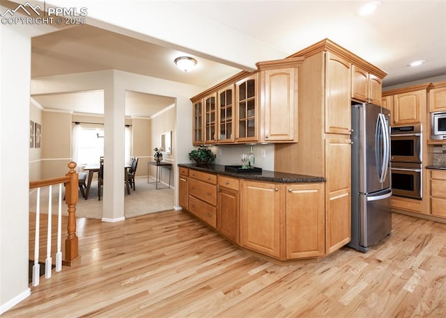 12515 Broad Oaks Dr, Colorado Springs, CO 80921 - kitchen featuring stainless steel appliances, light wood finished floors, glass insert cabinets, baseboards, and recessed lighting