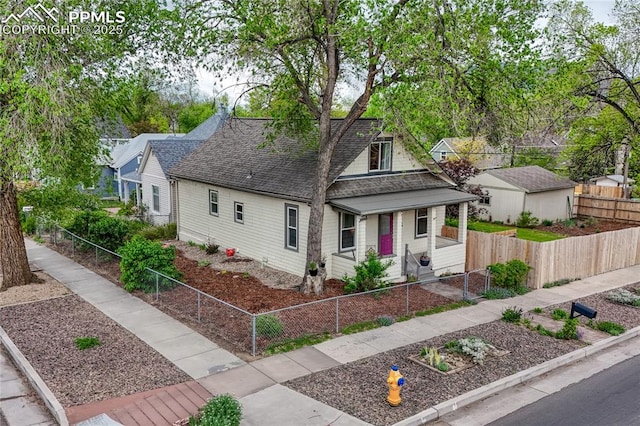 115 N 24th St, Colorado Springs, CO 80904 - view of front facade with a shingled roof, a porch, and a fenced front yard