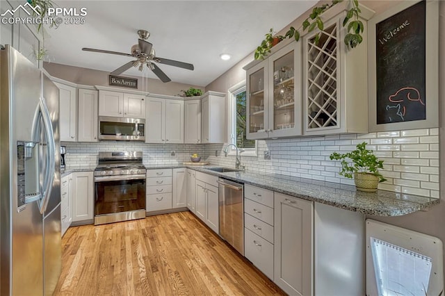 115 N 24th St, Colorado Springs, CO 80904 - kitchen with stainless steel appliances, a sink, ceiling fan, light stone counters, and recessed lighting