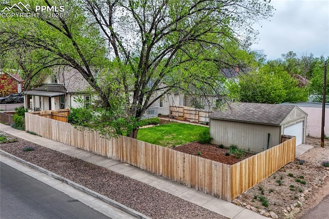 115 N 24th St, Colorado Springs, CO 80904 - view of front of property with an outdoor structure, a detached garage, and roof with shingles