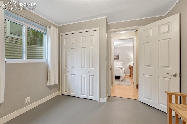 115 N 24th St, Colorado Springs, CO 80904 - unfurnished bedroom with crown molding, baseboards, and a closet