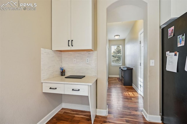 8445 Jacks Fork Dr, Colorado Springs, CO 80924 - hallway featuring dark wood finished floors and baseboards