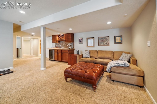 8445 Jacks Fork Dr, Colorado Springs, CO 80924 - living area featuring light colored carpet, wet bar, baseboards, and recessed lighting