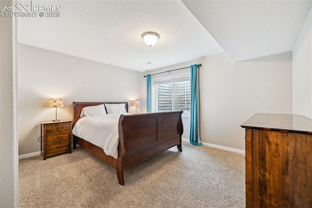 8445 Jacks Fork Dr, Colorado Springs, CO 80924 - carpeted bedroom featuring baseboards and a textured ceiling