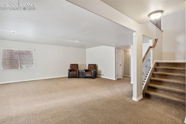 7663 Double Barrel Hts, Colorado Springs, CO 80923 - unfurnished room with carpet, stairs, a textured ceiling, and baseboards