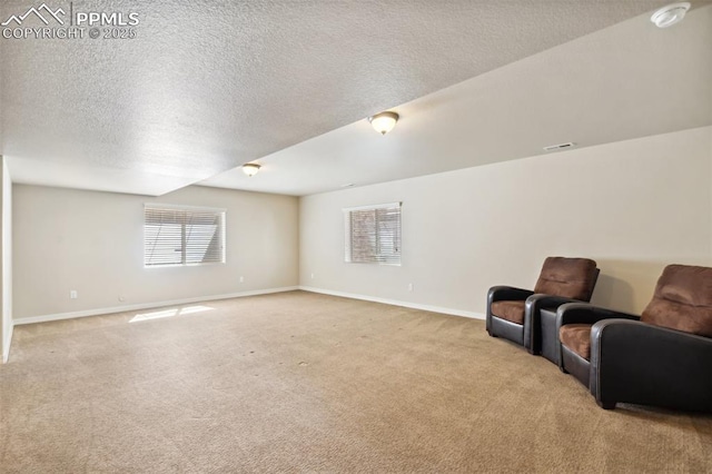 7663 Double Barrel Hts, Colorado Springs, CO 80923 - living room with carpet, baseboards, and a textured ceiling