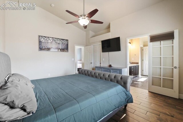 7719 Paca Pl, Fountain, CO 80817 - bedroom featuring dark wood-type flooring, high vaulted ceiling, connected bathroom, and a ceiling fan
