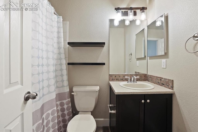 7719 Paca Pl, Fountain, CO 80817 - bathroom featuring toilet, tasteful backsplash, vanity, and a shower with shower curtain
