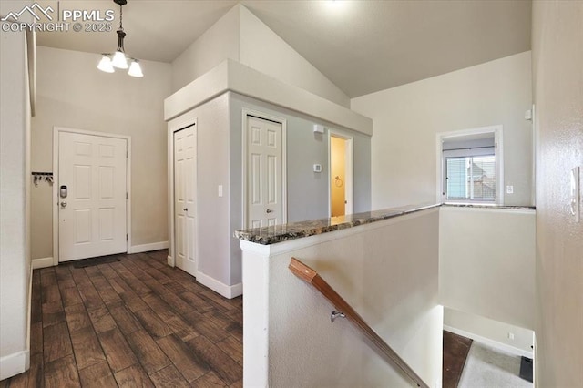 7719 Paca Pl, Fountain, CO 80817 - entrance foyer featuring dark wood-style floors, baseboards, and lofted ceiling