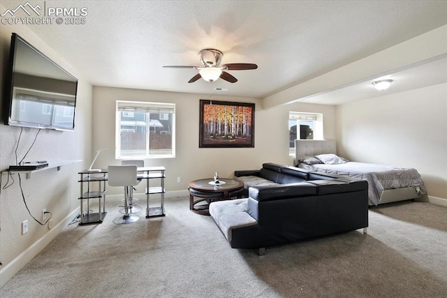 7719 Paca Pl, Fountain, CO 80817 - carpeted living room featuring a ceiling fan, plenty of natural light, and baseboards