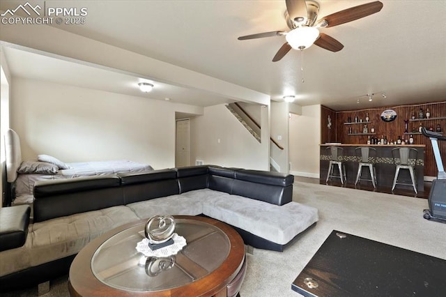 7719 Paca Pl, Fountain, CO 80817 - living room with stairway, a ceiling fan, carpet, and track lighting