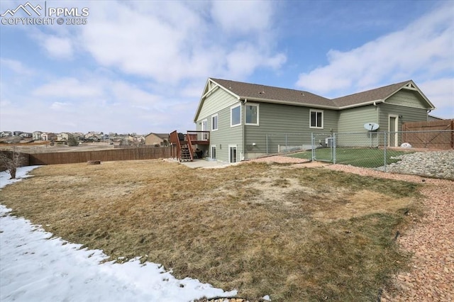 7719 Paca Pl, Fountain, CO 80817 - back of house featuring stairway, a fenced backyard, and a deck