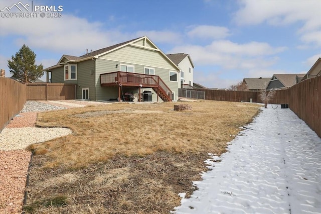 7719 Paca Pl, Fountain, CO 80817 - back of property featuring stairs, a fenced backyard, and a wooden deck