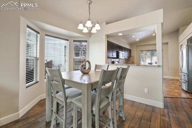 7719 Paca Pl, Fountain, CO 80817 - dining room featuring baseboards, a chandelier, dark wood-style flooring, and recessed lighting