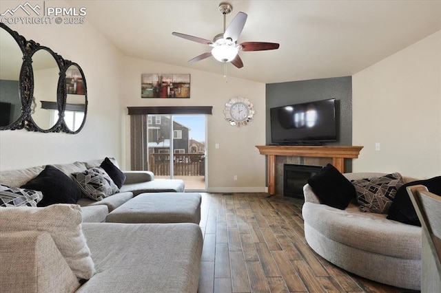 7719 Paca Pl, Fountain, CO 80817 - living area featuring a ceiling fan, wood finished floors, lofted ceiling, a fireplace with flush hearth, and baseboards