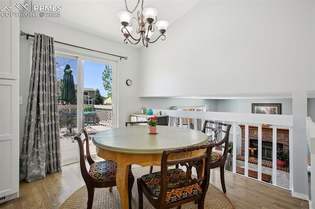 8360 Boxelder Dr, Colorado Springs, CO 80920 - dining area with wood finished floors and a chandelier
