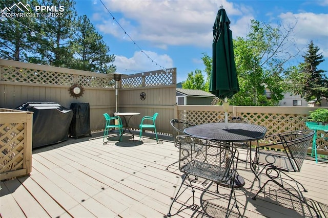 8360 Boxelder Dr, Colorado Springs, CO 80920 - deck featuring outdoor dining space and grilling area