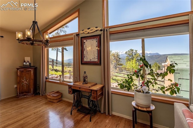 1053 Kings Crown Rd, Woodland Park, CO 80863 - sitting room with a chandelier, a mountain view, and healthy amount of natural light