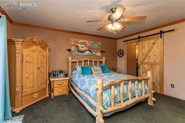 1053 Kings Crown Rd, Woodland Park, CO 80863 - bedroom featuring dark colored carpet, a barn door, crown molding, and a ceiling fan