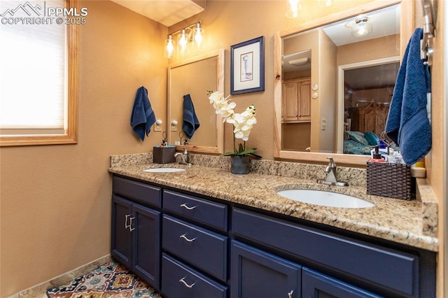1053 Kings Crown Rd, Woodland Park, CO 80863 - bathroom with double vanity and baseboards