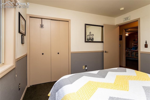 1053 Kings Crown Rd, Woodland Park, CO 80863 - bedroom with dark carpet and a closet