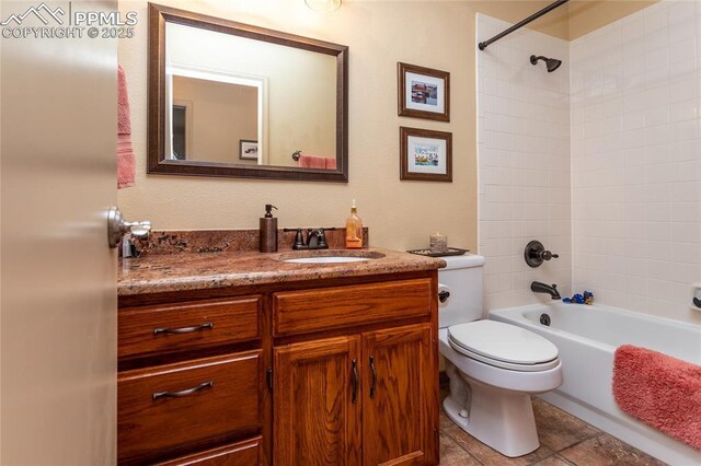 1053 Kings Crown Rd, Woodland Park, CO 80863 - bathroom with toilet, vanity, and tub / shower combination