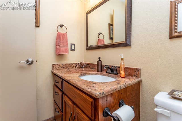 1053 Kings Crown Rd, Woodland Park, CO 80863 - half bathroom featuring vanity and toilet