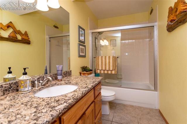1053 Kings Crown Rd, Woodland Park, CO 80863 - bathroom with vanity, toilet, combined bath / shower with glass door, and tile patterned floors