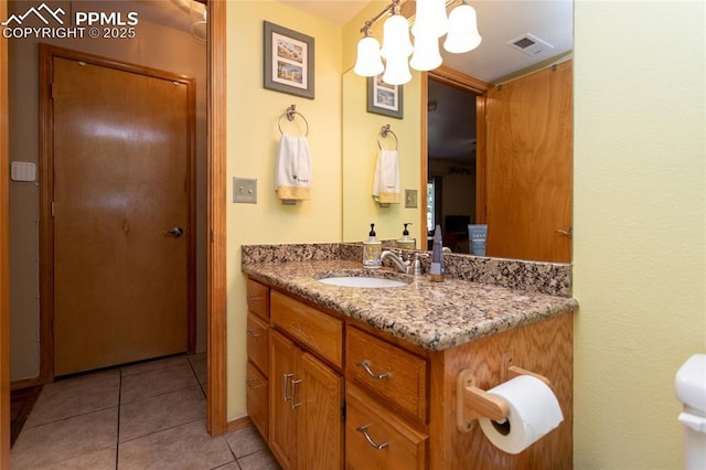 1053 Kings Crown Rd, Woodland Park, CO 80863 - bathroom featuring vanity, tile patterned flooring, and a chandelier