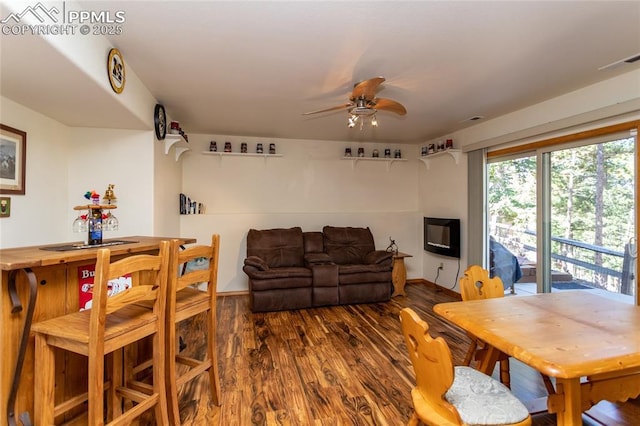 1053 Kings Crown Rd, Woodland Park, CO 80863 - dining area with a ceiling fan, wood finished floors, and baseboards