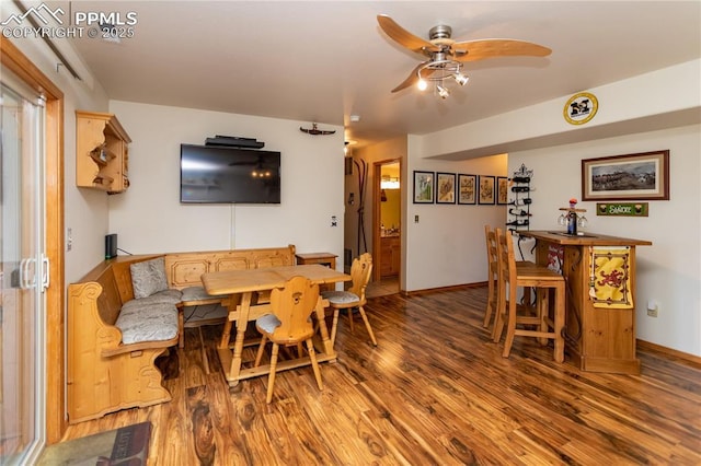1053 Kings Crown Rd, Woodland Park, CO 80863 - dining space with wood finished floors, ceiling fan, and baseboards