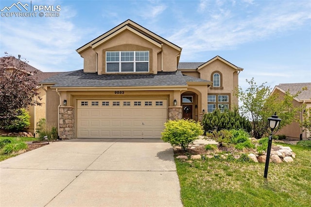 9883 Red Sage Dr, Colorado Springs, CO 80920 - traditional-style home featuring stucco siding, concrete driveway, a garage, and stone siding