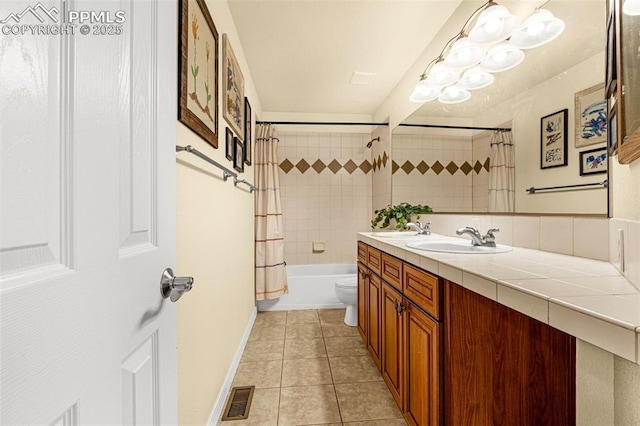 9883 Red Sage Dr, Colorado Springs, CO 80920 - full bath featuring vanity, tile patterned floors, shower / tub combo, toilet, and baseboards