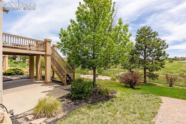 9883 Red Sage Dr, Colorado Springs, CO 80920 - view of yard featuring a patio and stairway
