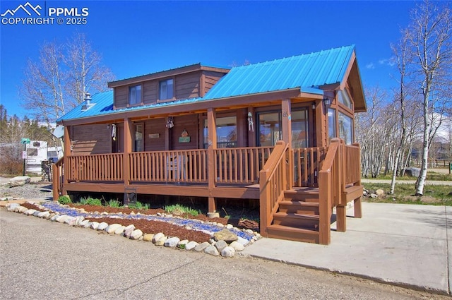 65 Sunshine Loop, Fairplay, CO 80440 - log home featuring a porch and metal roof