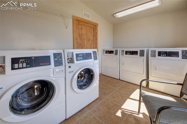 65 Sunshine Loop, Fairplay, CO 80440 - communal laundry room with washer and clothes dryer and light tile patterned floors