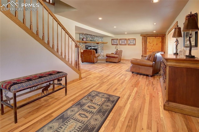 65 Sunshine Loop, Fairplay, CO 80440 - living area featuring light wood-style flooring, recessed lighting, a fireplace, stairway, and baseboards