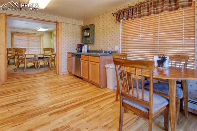 65 Sunshine Loop, Fairplay, CO 80440 - kitchen featuring stainless steel dishwasher, wallpapered walls, light wood-style floors, open shelves, and dark countertops