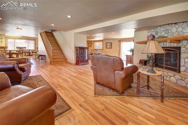 65 Sunshine Loop, Fairplay, CO 80440 - living area with stairway, wood finished floors, healthy amount of natural light, a stone fireplace, and recessed lighting