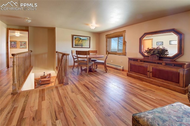 65 Sunshine Loop, Fairplay, CO 80440 - dining space with light wood-type flooring, baseboards, and a baseboard heating unit