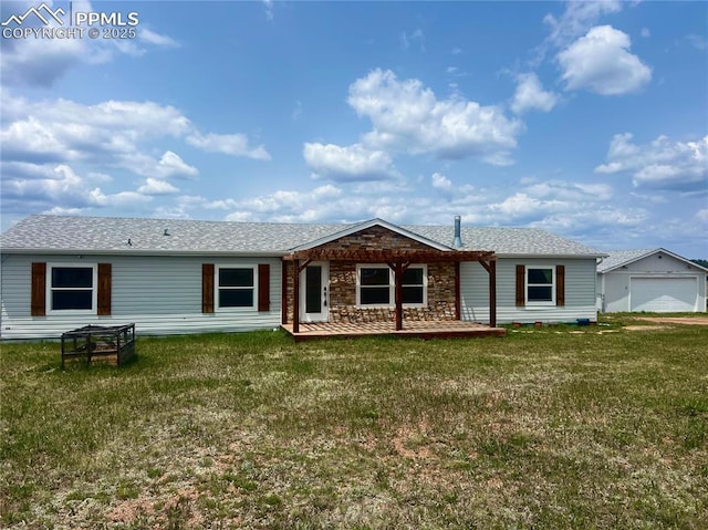 527 Golden Grain Ln, Divide, CO 80814 - view of front of house featuring a front lawn, a garage, and stone siding