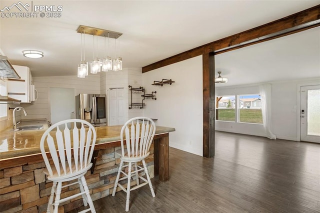 527 Golden Grain Ln, Divide, CO 80814 - dining space with dark wood-type flooring and baseboards
