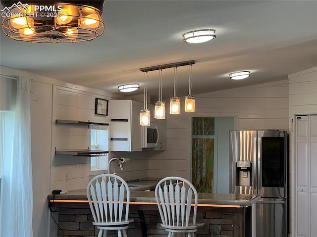 527 Golden Grain Ln, Divide, CO 80814 - dining room featuring a chandelier and vaulted ceiling