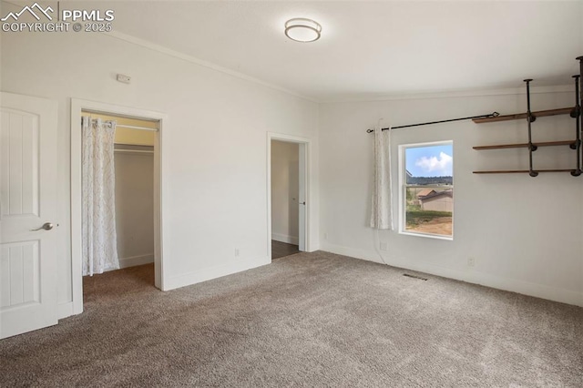527 Golden Grain Ln, Divide, CO 80814 - unfurnished bedroom with carpet flooring, ornamental molding, and baseboards