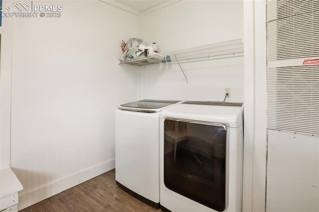 527 Golden Grain Ln, Divide, CO 80814 - laundry area featuring washer and dryer, dark wood-style floors, baseboards, and a heating unit